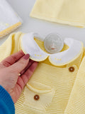 Pack amarelo 6 peças: fofo, camisola, gorro, collants, carapins e fralda