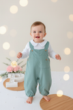 Conjunto verde: jardineiras bombazine e camisola com carda 3-12M