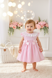Conjunto cerimónia rosa: vestido com laço grande nas costas e tapa fraldas