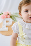 Conjunto Olívia: saia com tapa fraldas, alças e blusa