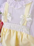 Conjunto Olívia: saia com tapa fraldas, alças e blusa